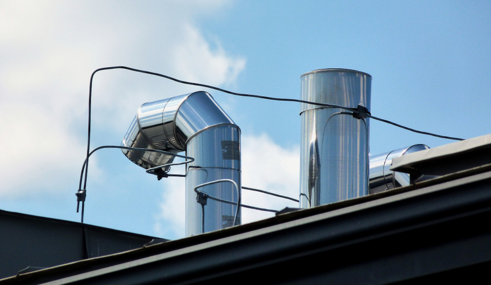 Commercial rooftop exhaust system connected to kitchen ventilation equipment