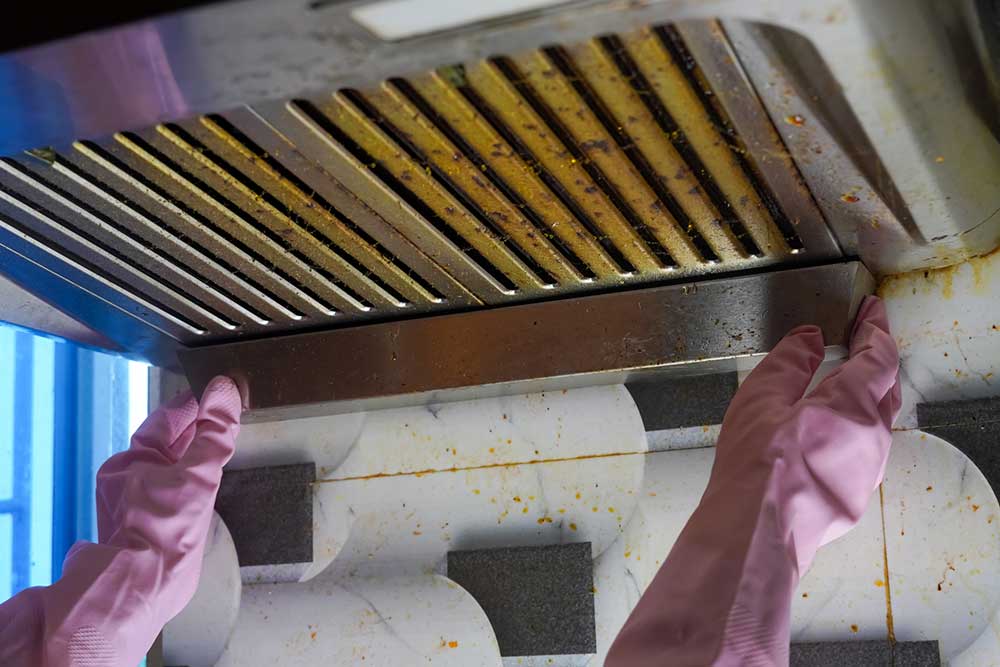 How Grease Buildup Affects Fire Code Compliance in Restaurant Kitchens